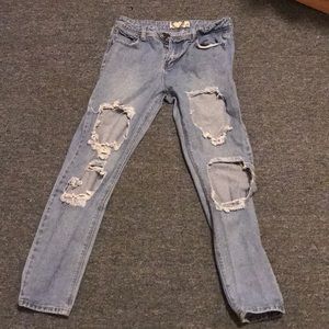 Ripped light washed blue jeans